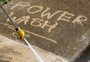 A yellow fire hydrant spraying water on the sidewalk.